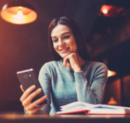 Surprised woman reading phone